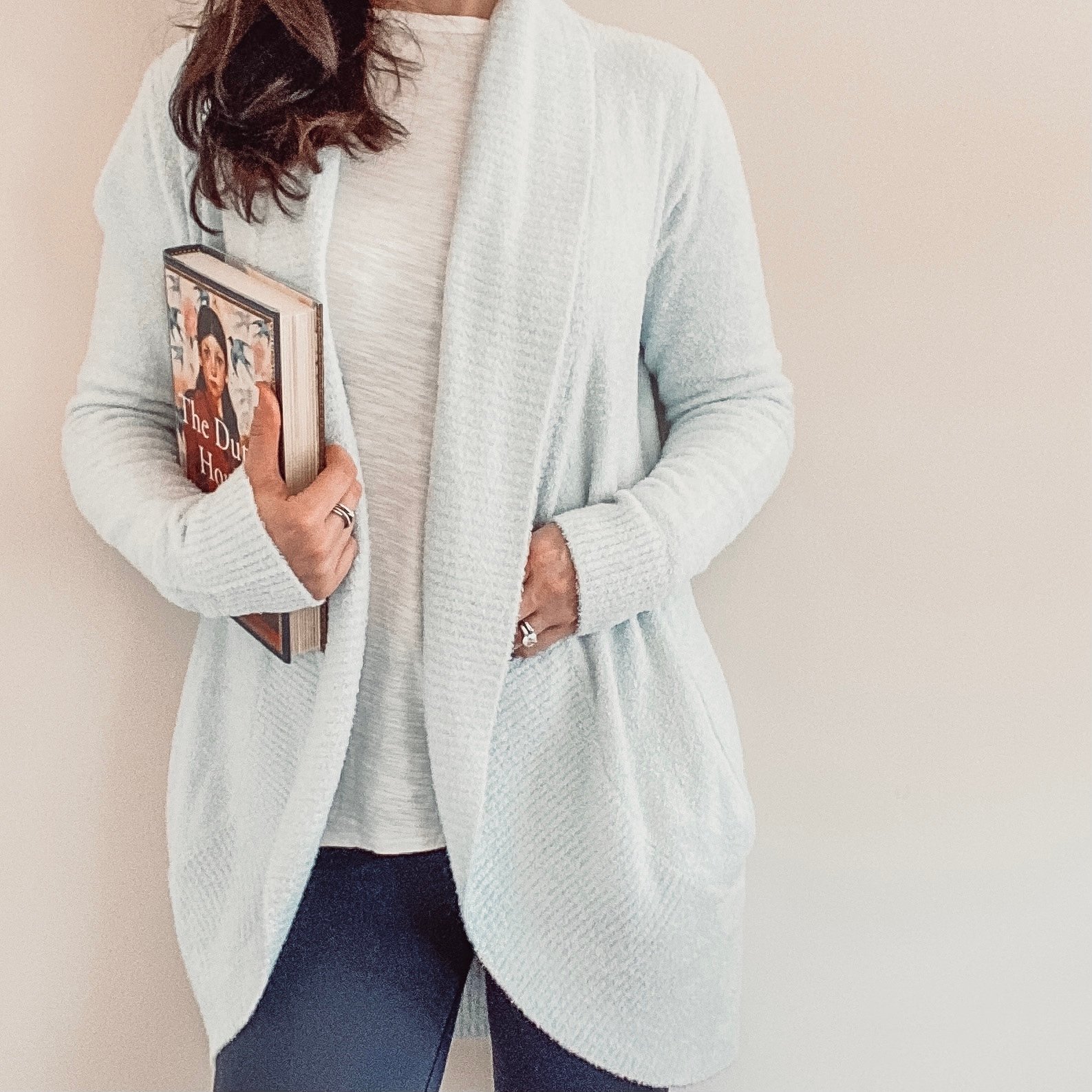 Barefoot Dreams cardigan sweater and book.