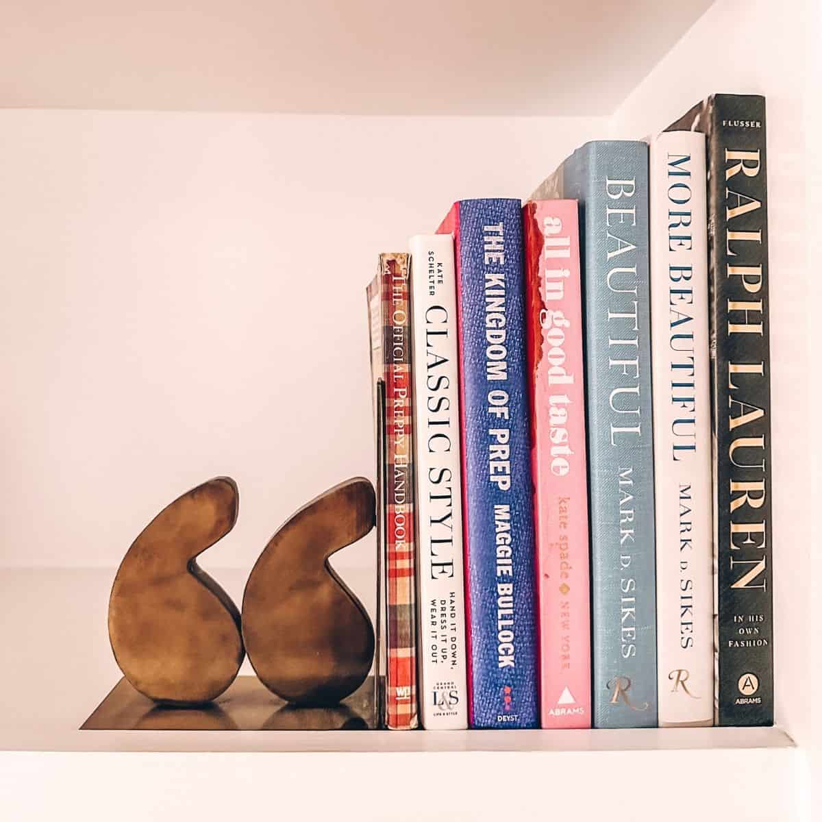 preppy books on bookshelf with bookend