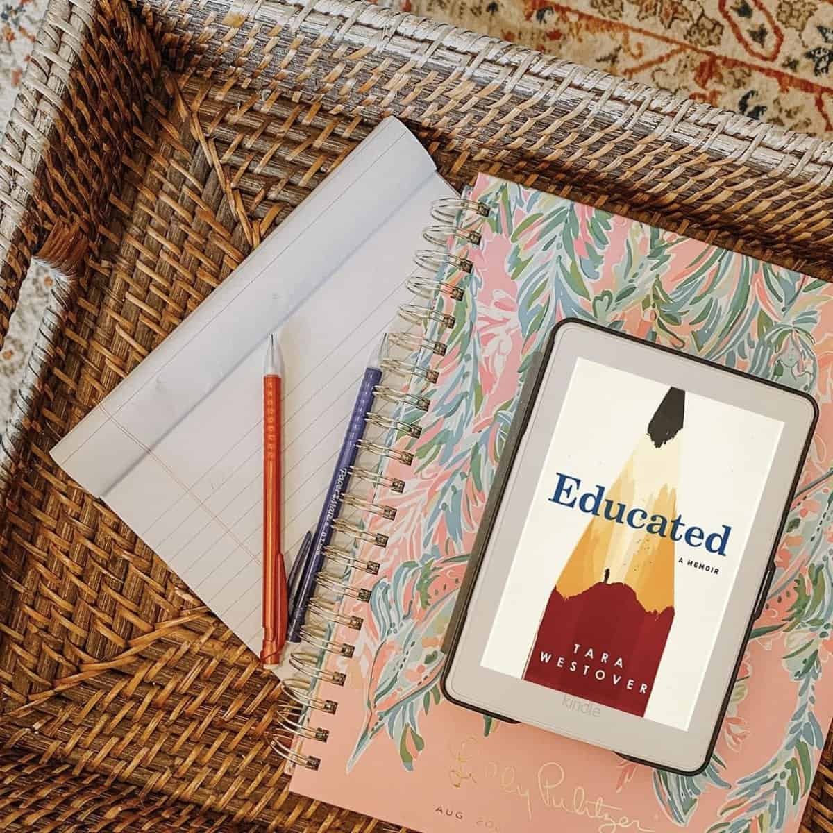 educated by tara westover with book and pencils.