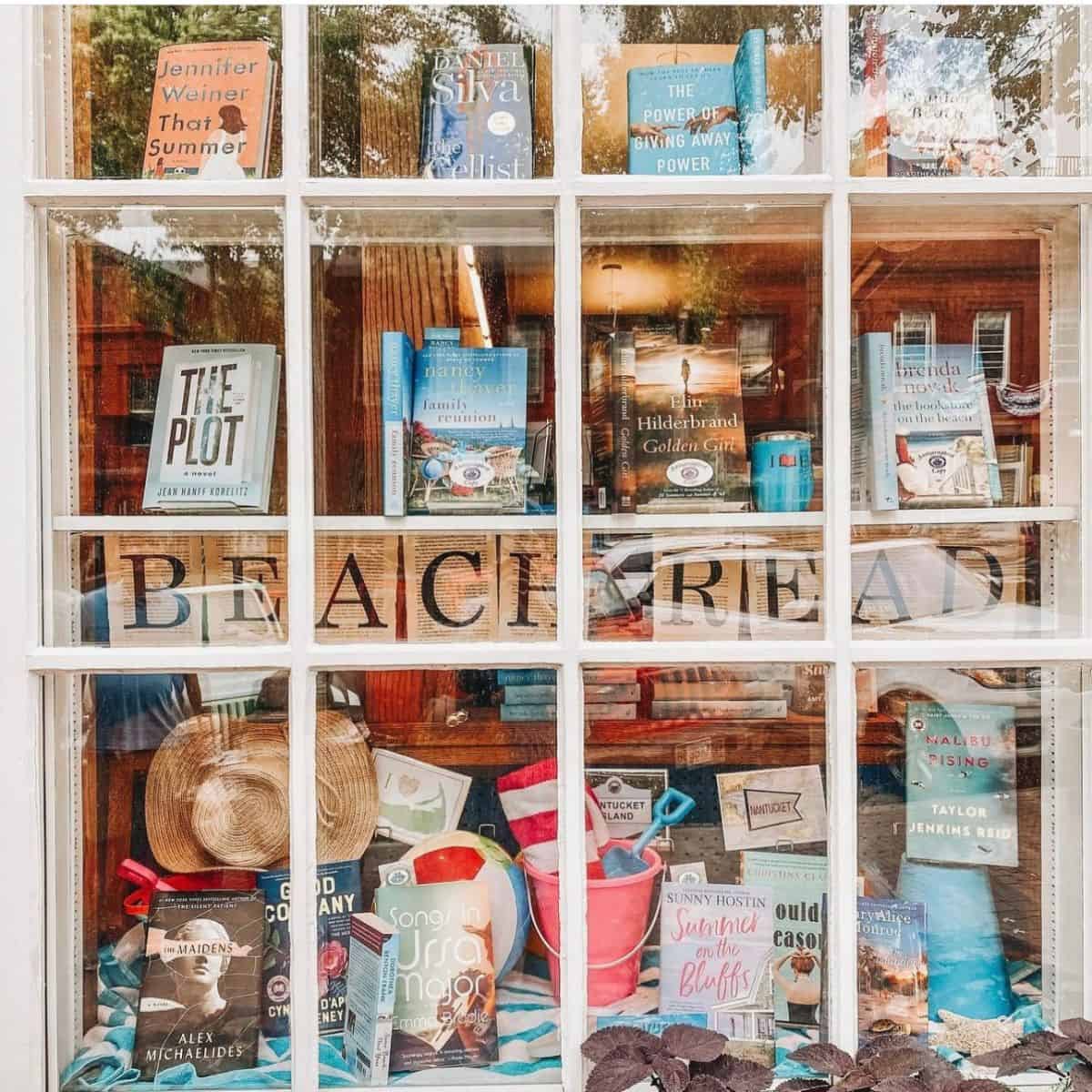 beach reads display in a bookstore window.