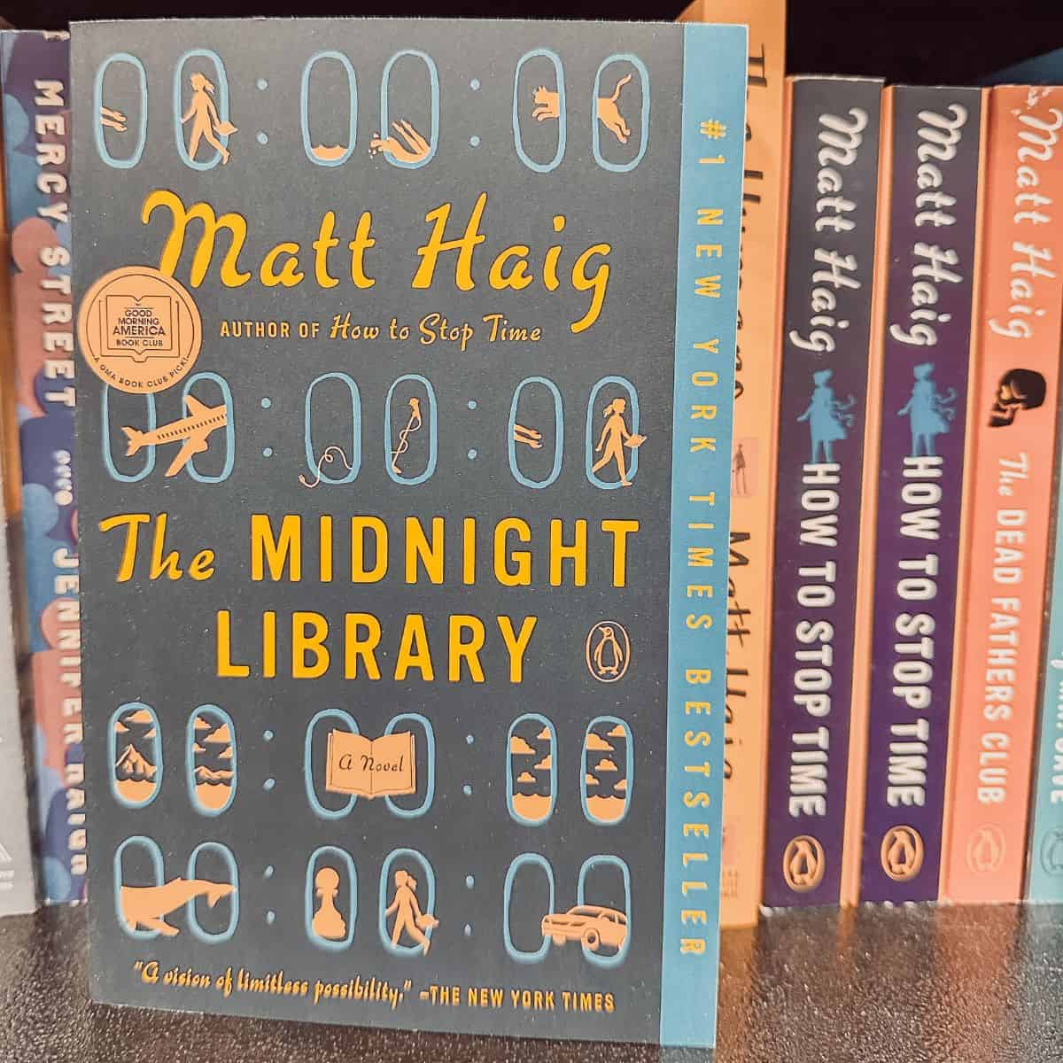 The Midnight Library by Matt Haig on a bookshelf with his other books.