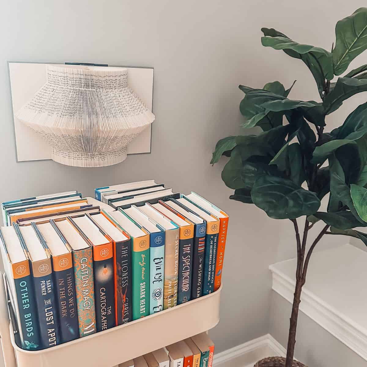 book rack with folded book art.