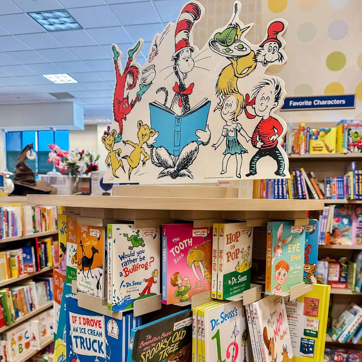 Dr. Seuss books on a bookshelf.