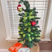 grinch inspired christmas tree with how the grinch stole christmas book.