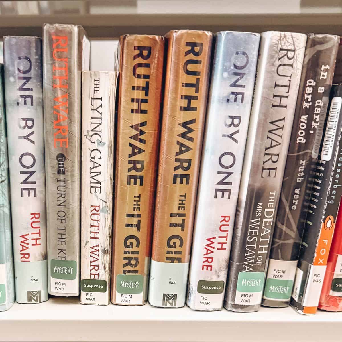 ruth ware's books on a bookshelf.