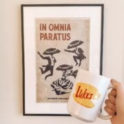 in omnia paratus poster and luke's diner mug from gilmore girls.