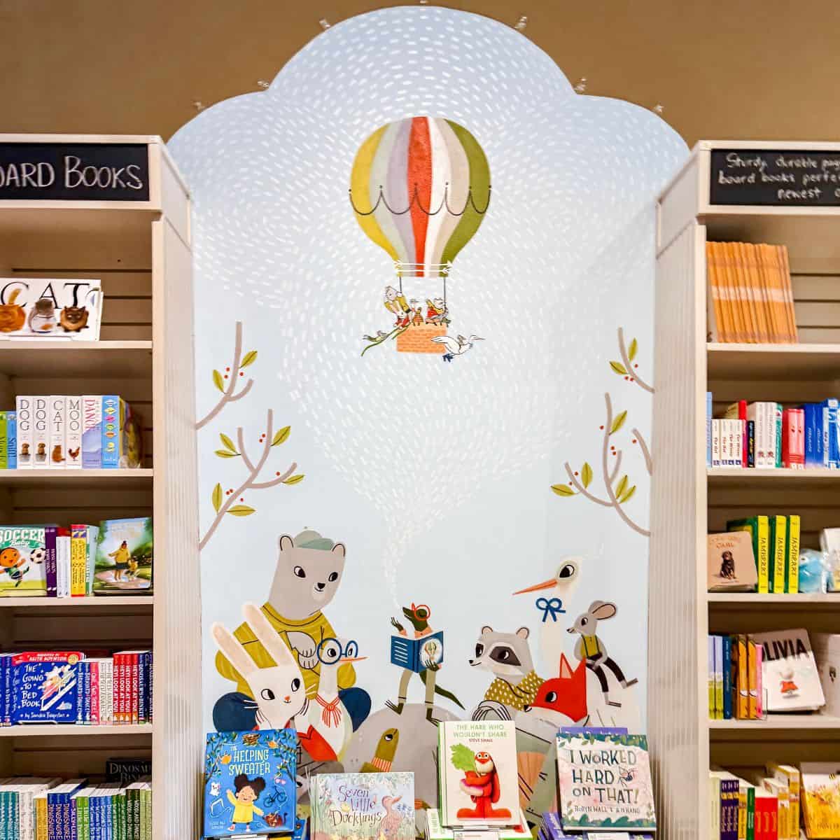 children's bookshelves and art at a bookstore.